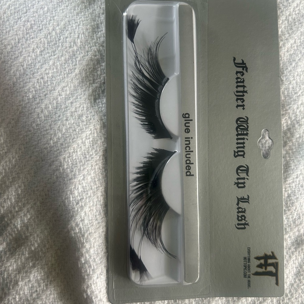 Fake eyelashes with feather, little pearls. kryolan is an amazing brand.
